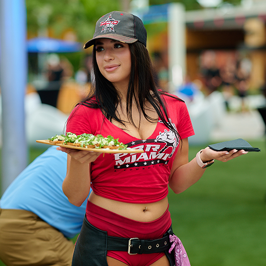 PBR Buckle Bunny serving food to guests.