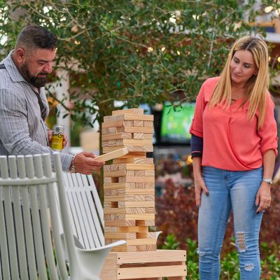 Couple playing Jenga at Vivo! Plaza.