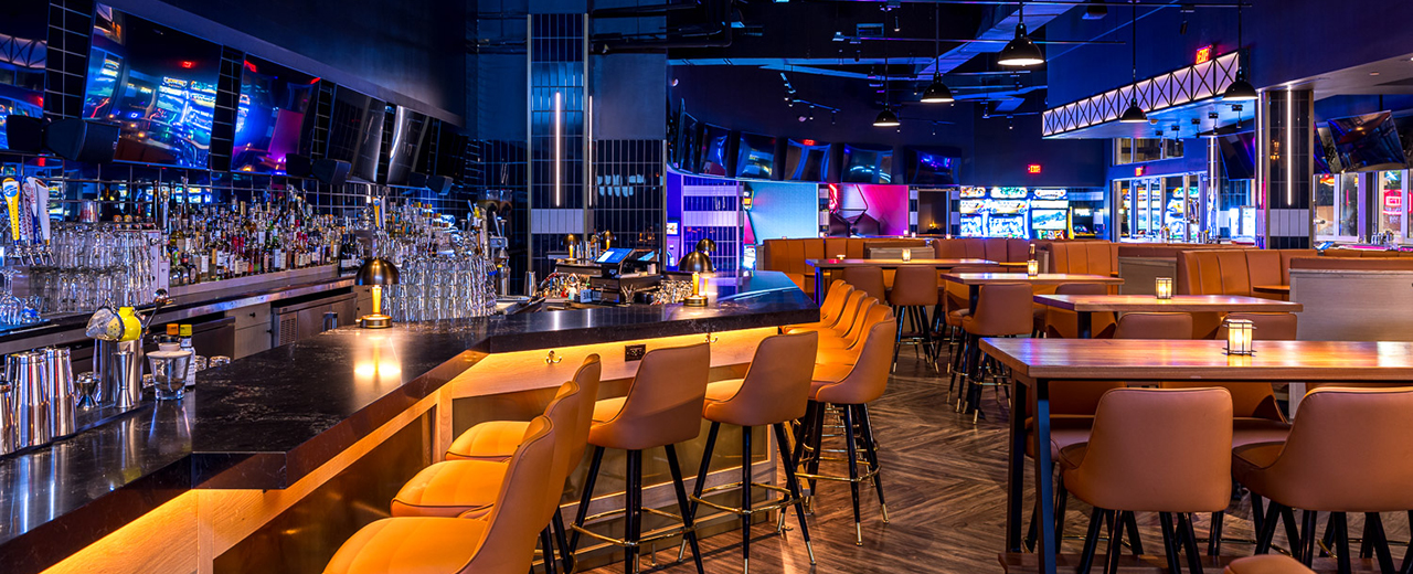 Bar and restaurant seating at Sports & Social Miami.